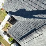 Asphalt shingle roof after replacement showing proper alignment and professional installation