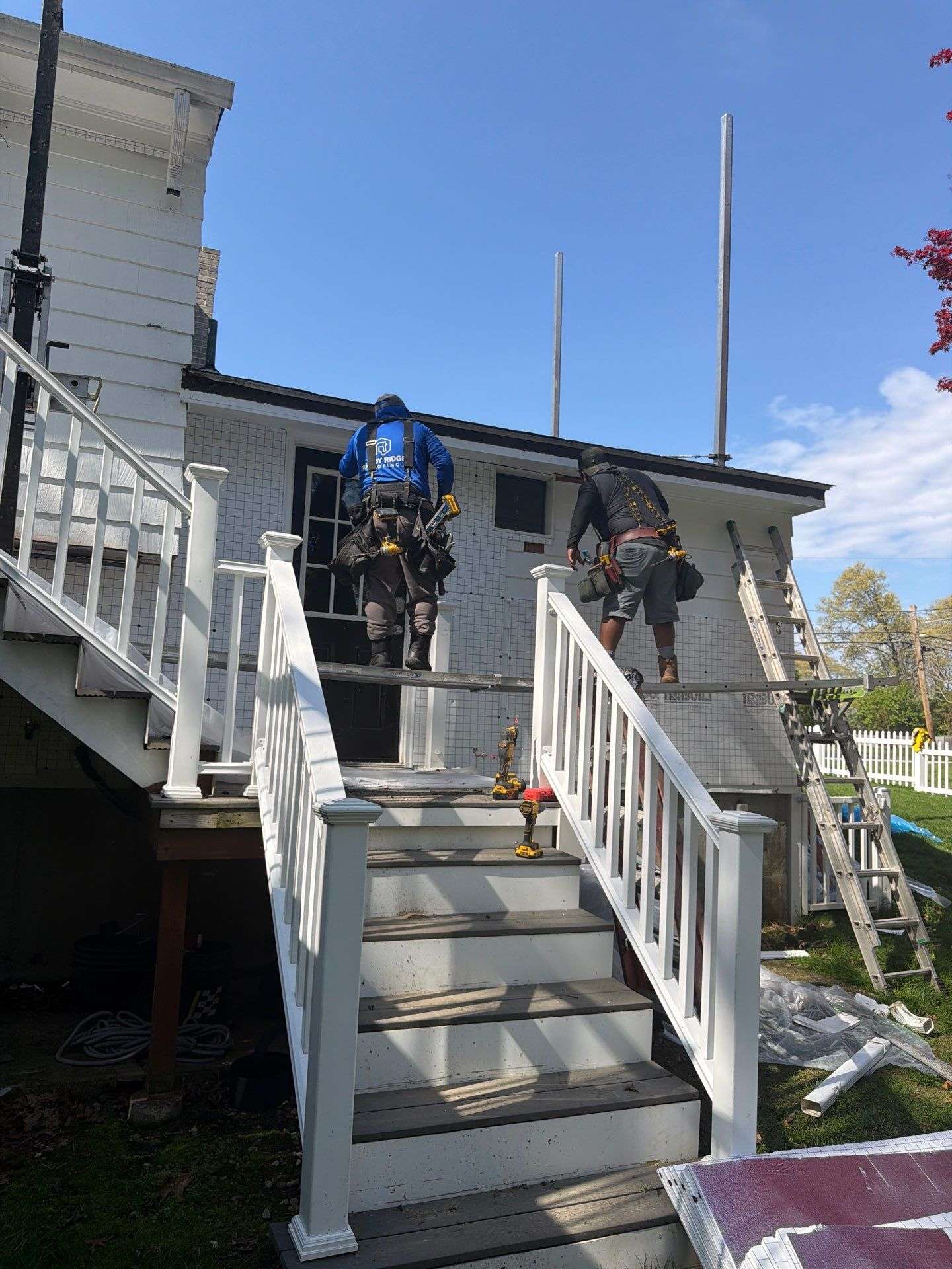 Professional roof replacement project showing modern residential roofing installation and exterior home improvement.
