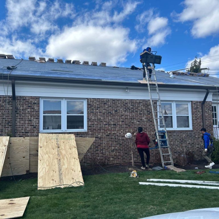 professional residential roofing service process Professional residential roofing service crew performing roof installation and repair work on a residential home.