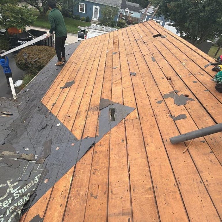 roof deck inspection after tear off Roof deck inspection after tear-off with exposed plywood decking on a residential roof