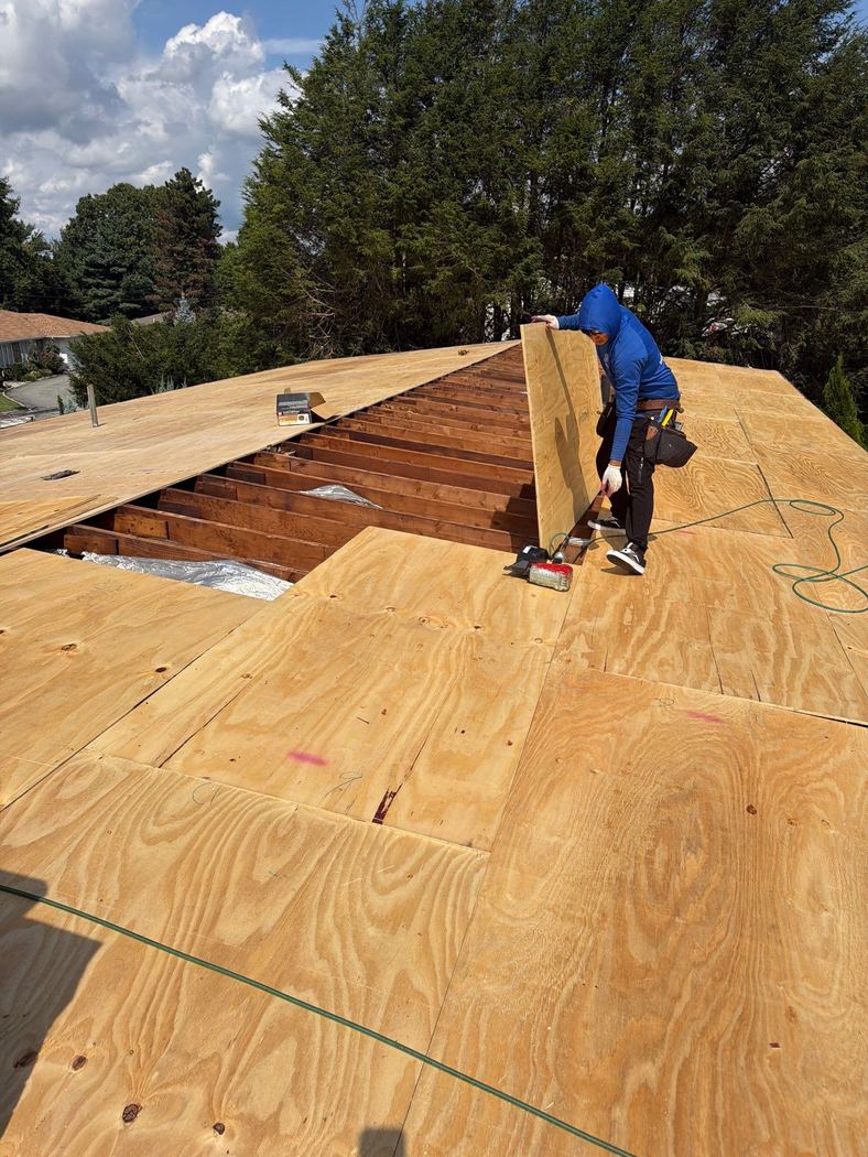 plywood roof sheathing installation rhode island New plywood roof sheathing panels installed across a residential roof in Rhode Island