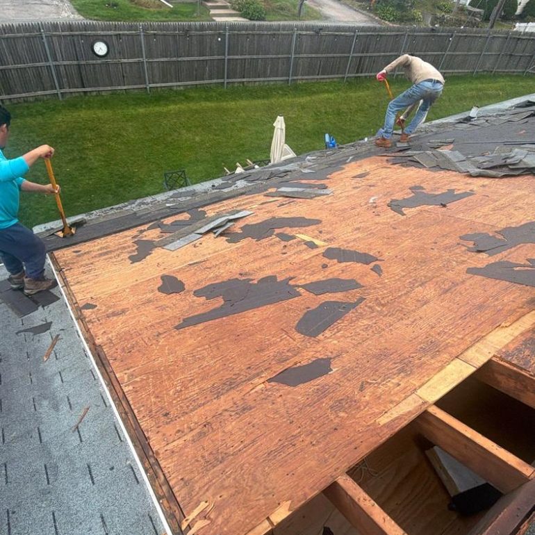roof sheathing moisture damage rhode island Roof sheathing exposed during shingle removal with areas of worn and damaged plywood